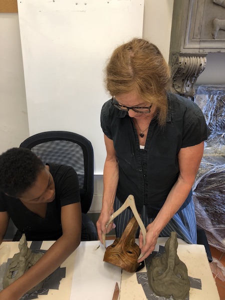 Joan Hartman working with the Commedia dell'Arte students to create original masks.